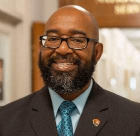 Portrait of Reggie Chapple, Acting Assistant Director of Partnerships & Civic Engagement at the National Park Service